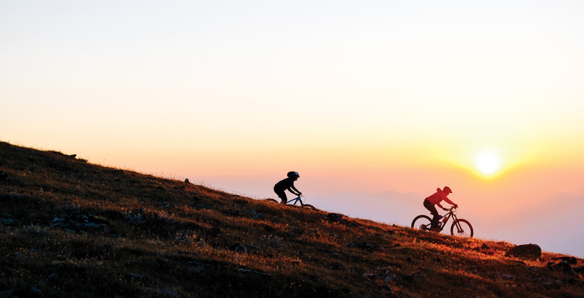 Nicki Trimble and Erin Bergey ride through the last flush of color on a dusk-lit descent in the Big Belt Mountains of Montana. Classified as an island range, the Big Belts are isolated as if adrift in a sea of Montana’s vast prairies and flatlands.