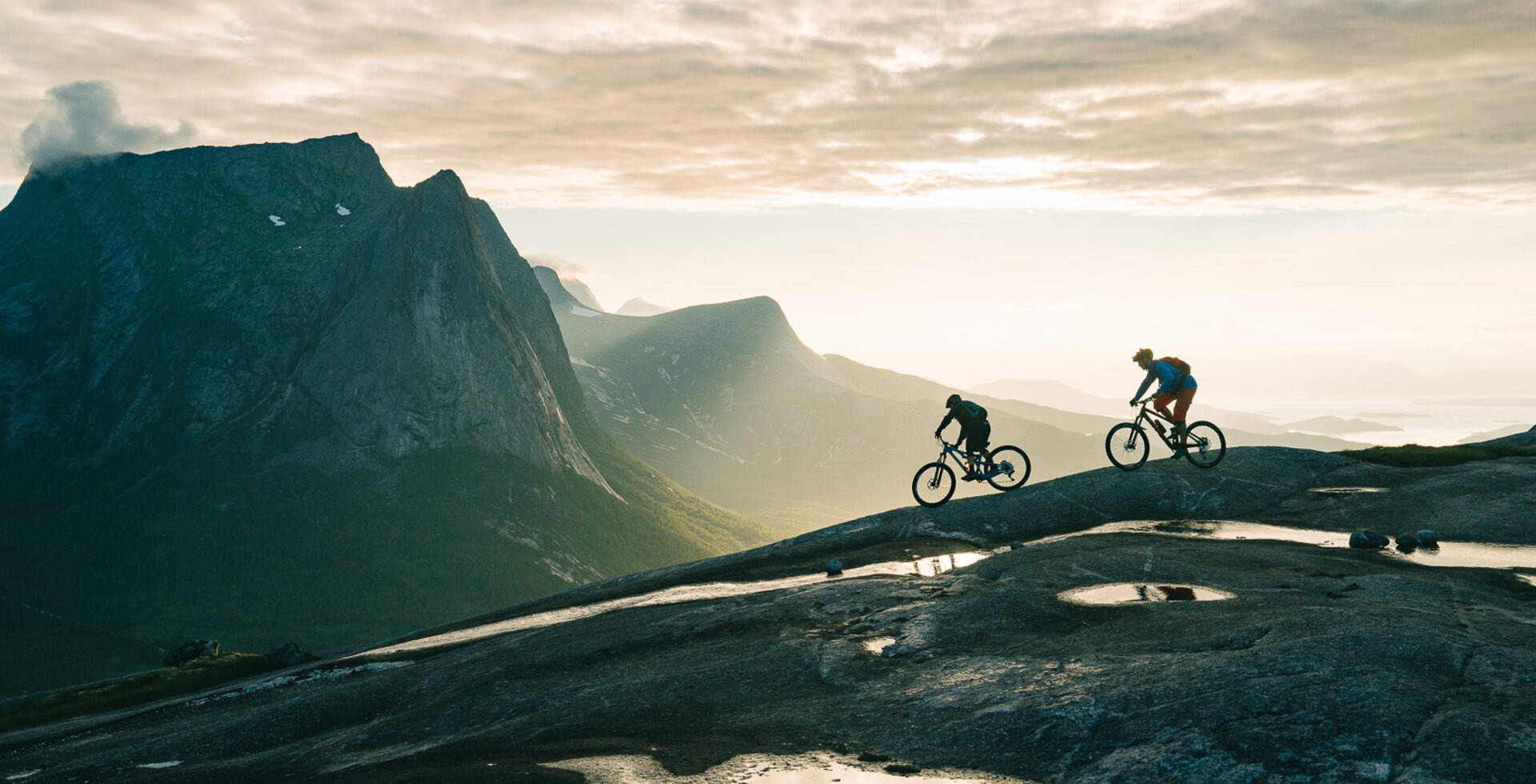 Jaime Hill and Daniel Larsson dropping into the continuous 1,150-foot slickrock descent of Henriknesfjellet. Narvik, Norway.