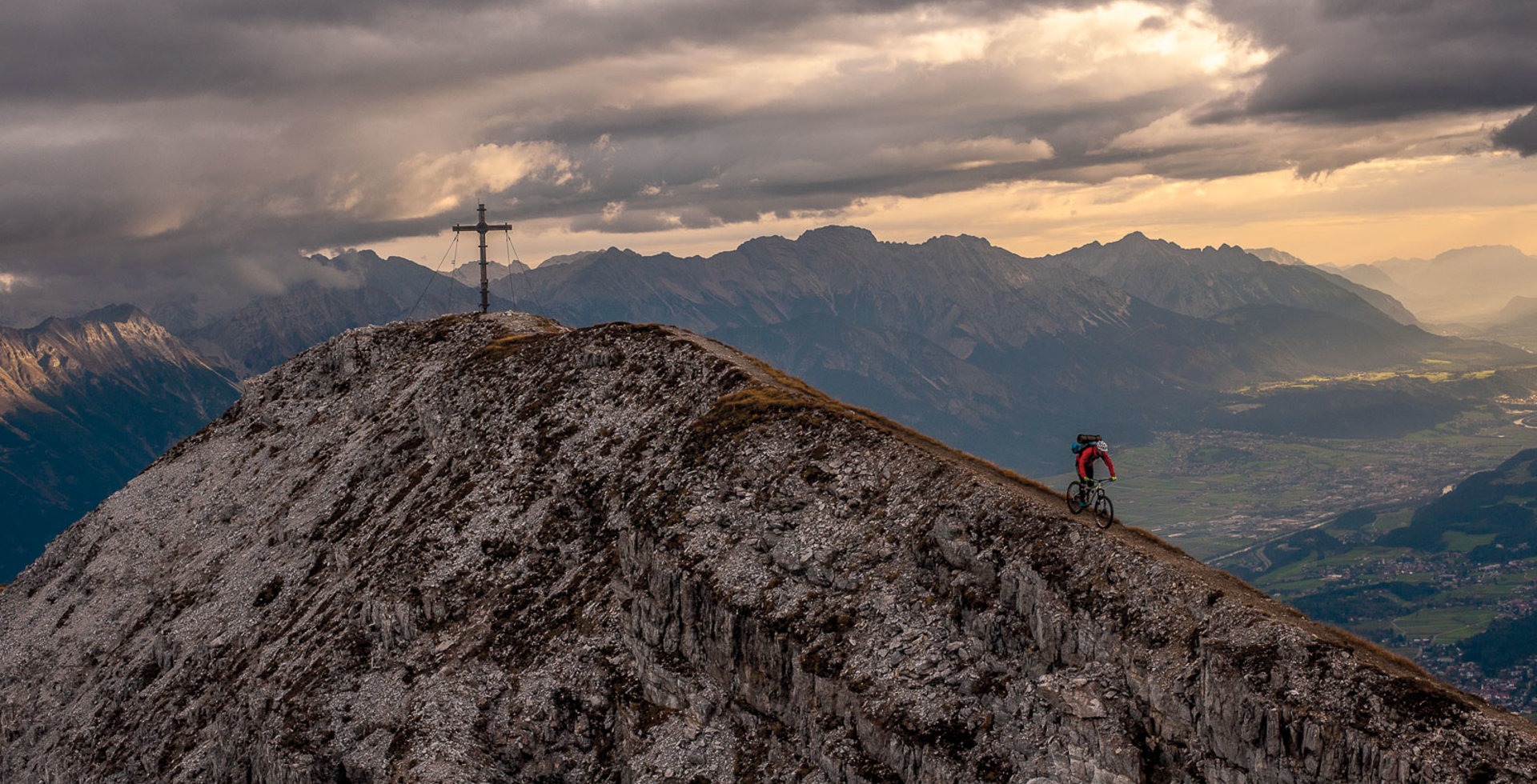 “Matthias Oehlboeck rides the ridgeline from the summit of Nockspitze after spending the night on the mountain. Enjoying a solitary, sunrise view over your hometown only makes you love it more, but with half of Innsbruck’s population being addicted to the outdoors, you’re rarely there by yourself. This particular night we shared the summit with three paragliders, who launched back to the valley the next morning.” Photo: Andreas Vigl