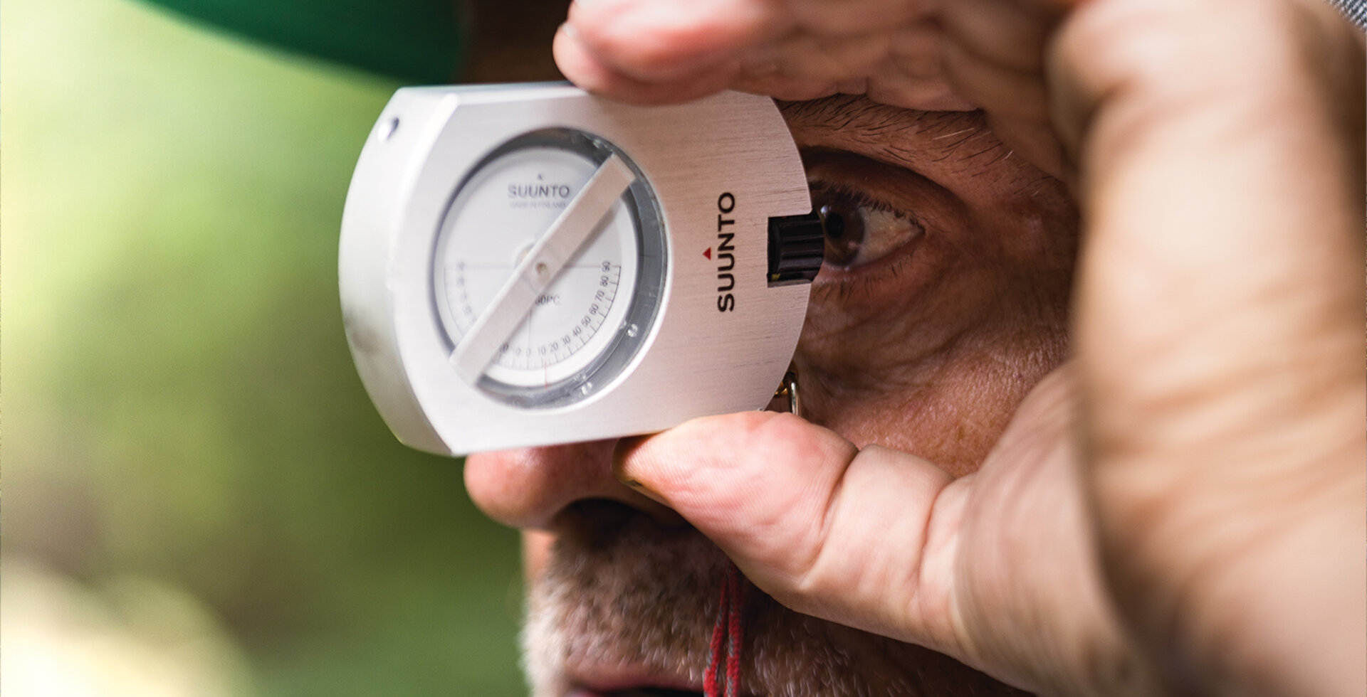 Gravity Logic co-founder Tom “Pro” Prochazka uses a clinometer to measure the grade of a slope during a build in British Columbia. Prochazka worked as the manager of the Whistler Bike Park from 2001 to 2007. Photo: Robin O’Neill