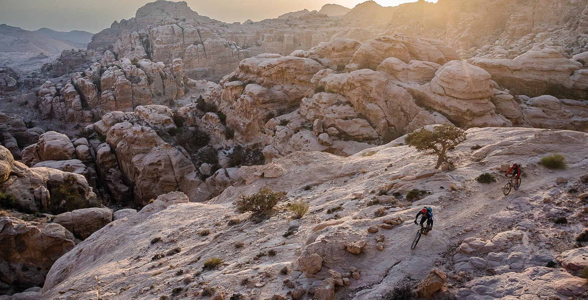 Andrew Findlay leads Sari Husseini through a rocky section of the Jordan Trail in the Shobak Qasabah District of Jordan.