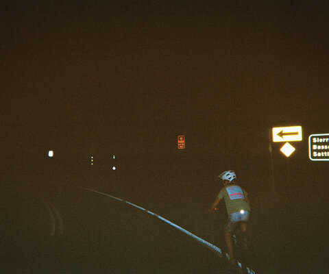 Junie rides back to camp after a Freehub PRESENTS film screening at the historic Yuba Theatre in Downieville.