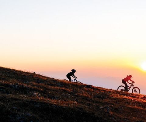 Nicki Trimble and Erin Bergey ride through the last flush of color on a dusk-lit descent in the Big Belt Mountains of Montana. Classified as an island range, the Big Belts are isolated as if adrift in a sea of Montana’s vast prairies and flatlands.