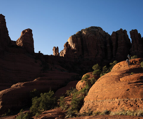 Amaryth “Amo” Gass and Evan Puglia, of the Sedona Mountain Bike Academy, find some steeps off Chicken Point in Sedona. Perhaps nowhere in Arizona has folded mountain biking into its identify so successfully as Sedona. Photo: Anne Keller | SONY 1/500, f/7.1, ISO 320