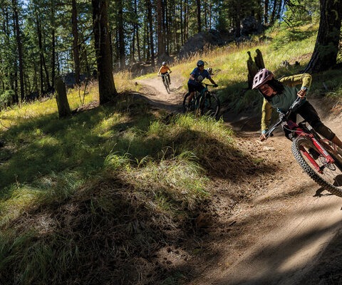 Brooklyn Bell leads the pack on Berm and Ernie, a local favorite trail near McCall, Idaho. The trail’s twists and turns are flowy, but with character.