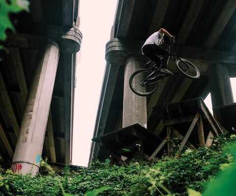 As the first urban mountain bike park in the United States, Colonnade opened the door on an entirely new realm for the sport—and thanks to the then-fledgling Evergreen Mountain Bike Alliance, set the bar for what community-based advocacy could accomplish. Carson Storch styles a 360 while demonstrating proper under-Interstate form.