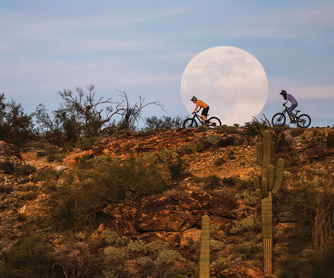 On South Mountain's popular National Trail, riders Bryce Straka (left) and Elliott Milner cruise past the first supermoon of 2026 during an evening spin. Photo: Eric Mickelson | NIKON 1/2000, f/6.3, ISO 500