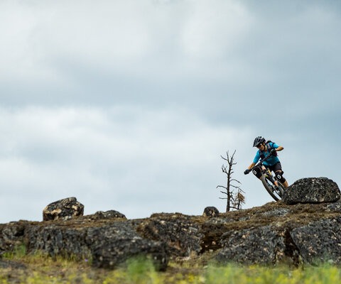 Sonya Looney leans into the rock at the top of Wedding Crashers, a trail known for its granite slabs and technical options.