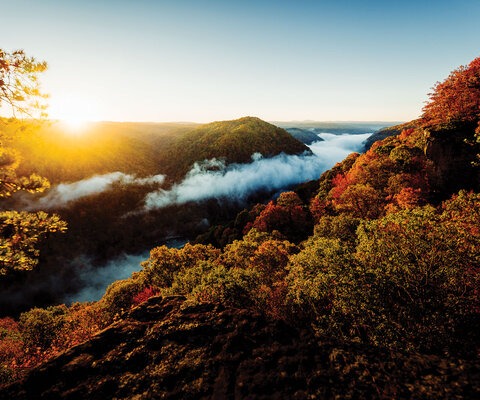 An autumn sunrise takes place over the New River Gorge. It may be called the New River, but it’s one of the oldest on the continent. Running north, it cuts through steep canyons to carve out an impressive gorge. Photo by Chris Jackson | NIKON 1/160, f/3.5, ISO 400