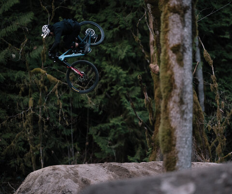 As the sun drops behind the mountains in Squamish, BC, Bringhurst puts in a few final reps on the local dirt jumps with headlights on his bike. Photo: Anthony Smith