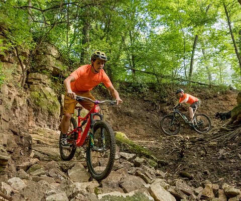 Rock Solid trailbuilders Jahmey Hamilton and Kyle McGurk put a section of fresh stonework to the test on War Eagle, one of the new lines they built on Grandad Bluff.