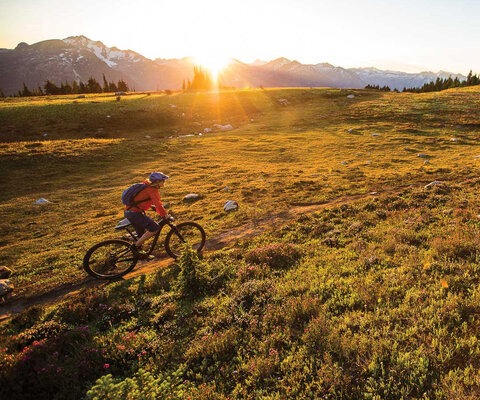 One of the West Kootenays’ rare alpine rides, Frisby Ridge is a one-of-a-kind alpine epic, winding through meadows and ringed by the towering Selkirks. Lorraine Blancher pedals her way through one of the trail’s signature meadows under a blazing sunset. CANON, 1/2000 sec, f/3.5, ISO 1600